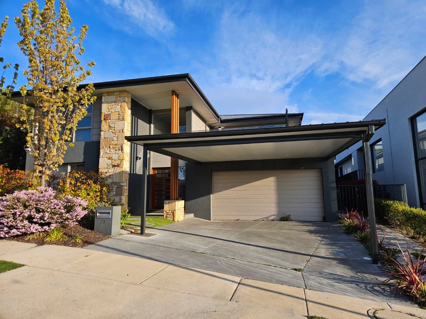 Cantilevered carport with feature timber posts