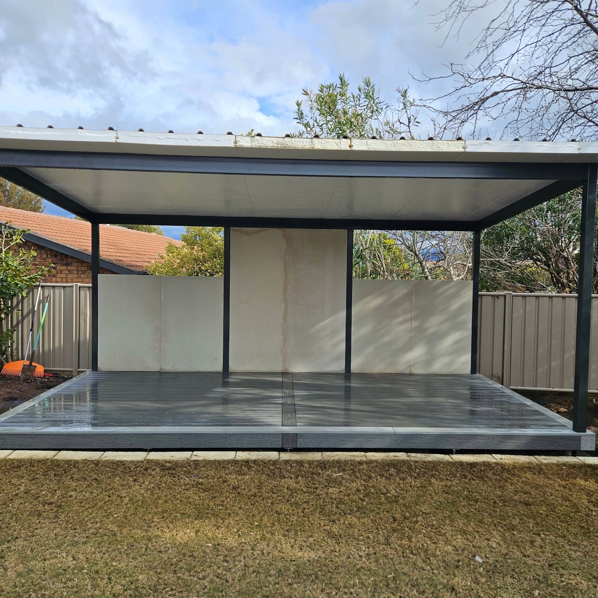 Elevated hardwood deck with full-length patio roof